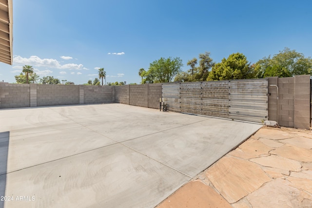 view of patio / terrace featuring a gate and fence