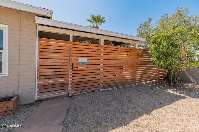 view of gate featuring fence