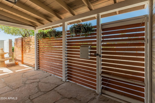 view of patio featuring a gate and fence