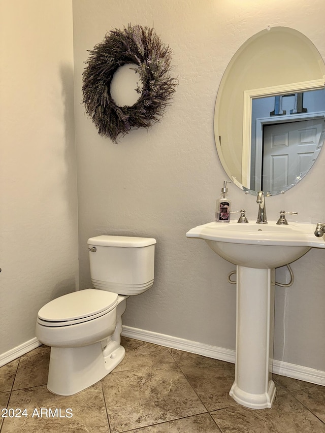 bathroom featuring tile patterned floors and toilet