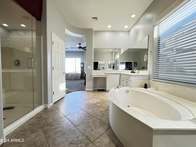 bathroom with plus walk in shower, vanity, tile patterned floors, and ceiling fan