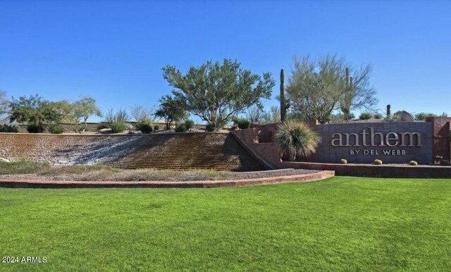 community sign featuring a lawn