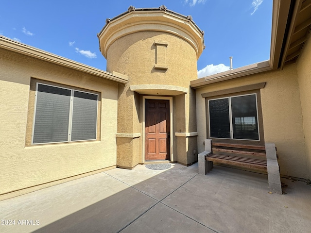 property entrance with a patio area