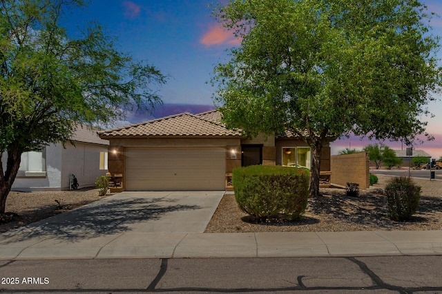 5320 E Silverbell Rd, San Tan Valley, AZ 85143 - view of front of house with stucco siding, an attached garage, a tile roof, and concrete driveway