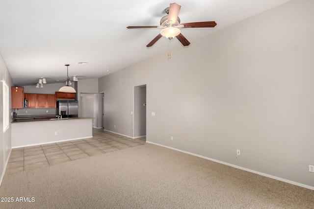 5320 E Silverbell Rd, San Tan Valley, AZ 85143 - unfurnished living room featuring a ceiling fan, vaulted ceiling, light carpet, baseboards, and light tile patterned floors