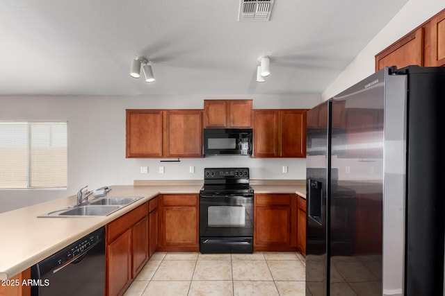 5320 E Silverbell Rd, San Tan Valley, AZ 85143 - kitchen featuring black appliances, a sink, light countertops, and brown cabinets