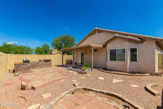 5320 E Silverbell Rd, San Tan Valley, AZ 85143 - back of property with stucco siding, a fenced backyard, and a patio area