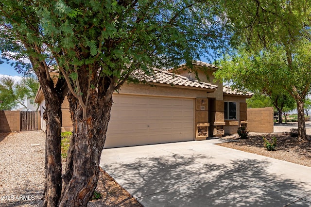 5320 E Silverbell Rd, San Tan Valley, AZ 85143 - view of front of house with driveway, a gate, stucco siding, a garage, and a tile roof