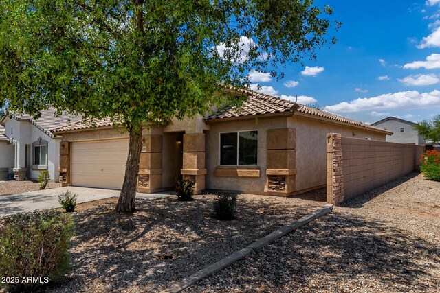 5320 E Silverbell Rd, San Tan Valley, AZ 85143 - view of front of house featuring stucco siding, a garage, a tile roof, and concrete driveway
