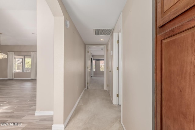 hall with light hardwood / wood-style floors