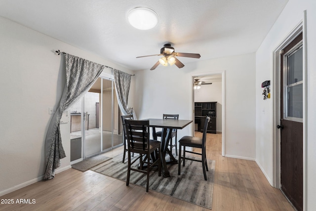 255 N Hunt Dr E, Mesa, AZ 85203 - dining space featuring a ceiling fan and hardwood / wood-style flooring