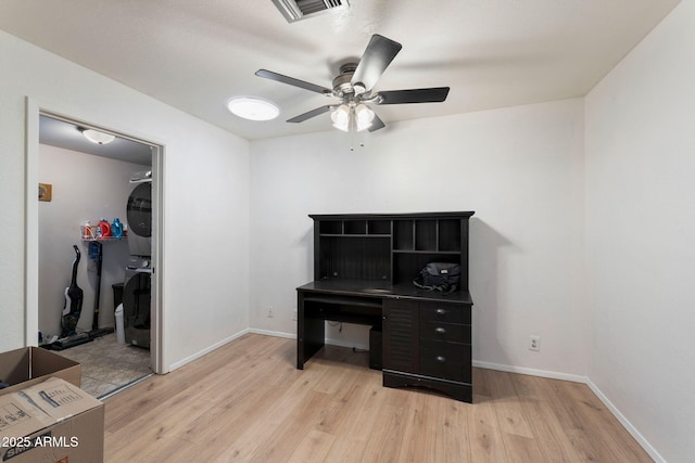 255 N Hunt Dr E, Mesa, AZ 85203 - unfurnished office featuring stacked washer / drying machine, light wood finished floors, and a ceiling fan