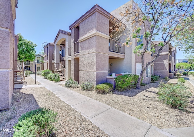 view of home's community with a residential view and stairway