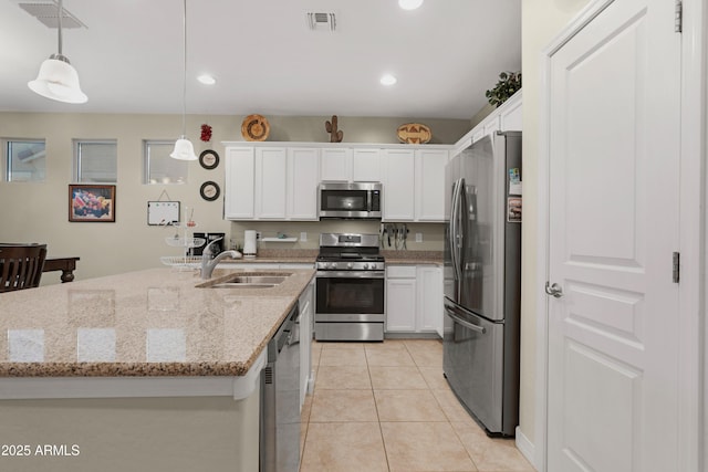 kitchen with white cabinetry, appliances with stainless steel finishes, a sink, and visible vents