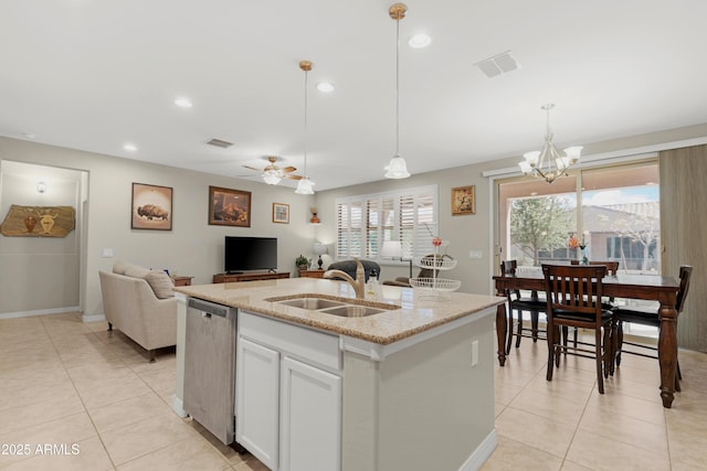 kitchen featuring light tile patterned floors, visible vents, a sink, and dishwasher