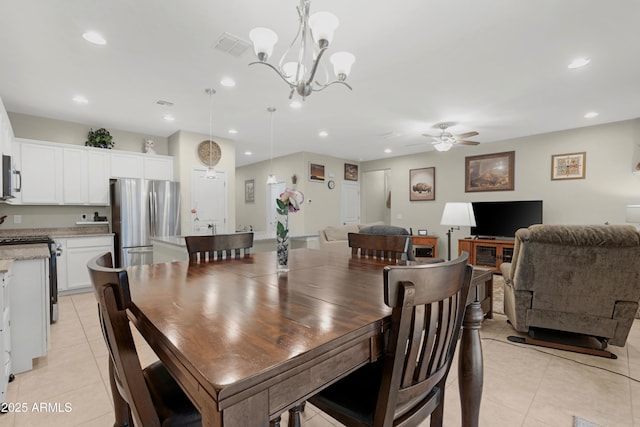 dining room featuring recessed lighting, ceiling fan with notable chandelier, light tile patterned floors, and visible vents