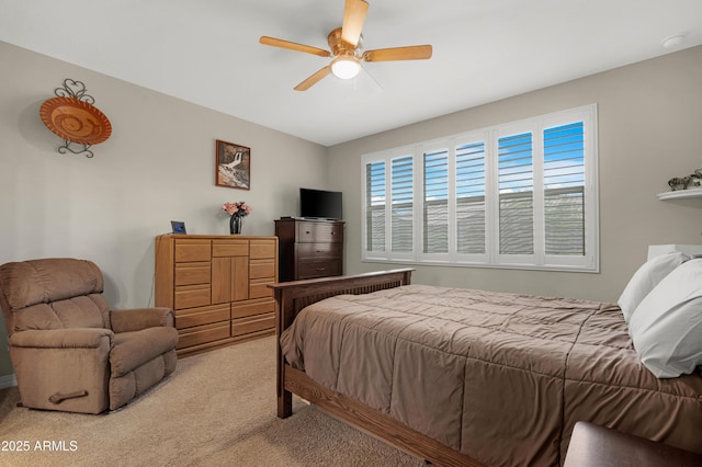 bedroom with ceiling fan and light colored carpet