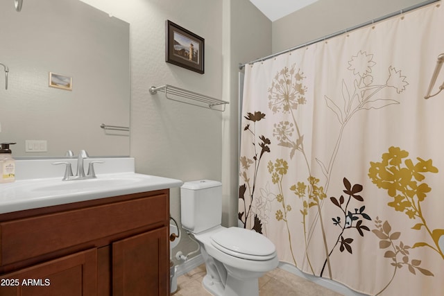 full bathroom with toilet, tile patterned floors, curtained shower, and vanity