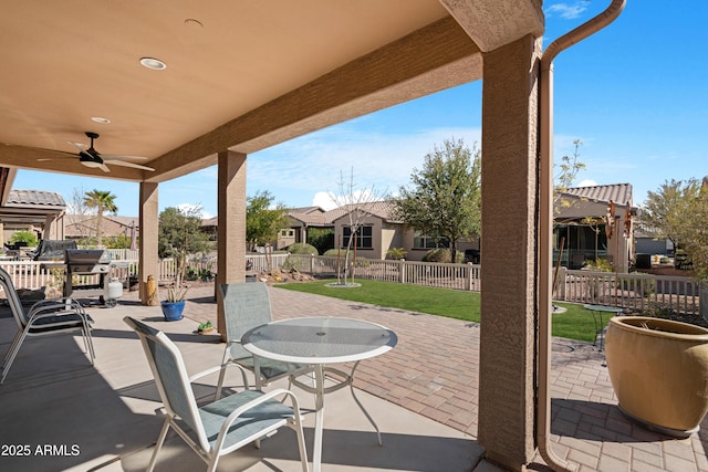 view of patio / terrace featuring a ceiling fan and fence