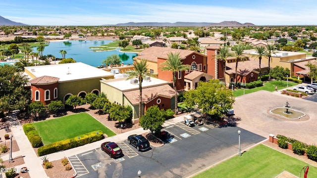 aerial view featuring a residential view and a water and mountain view