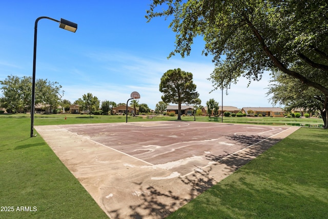 view of basketball court featuring community basketball court and a yard