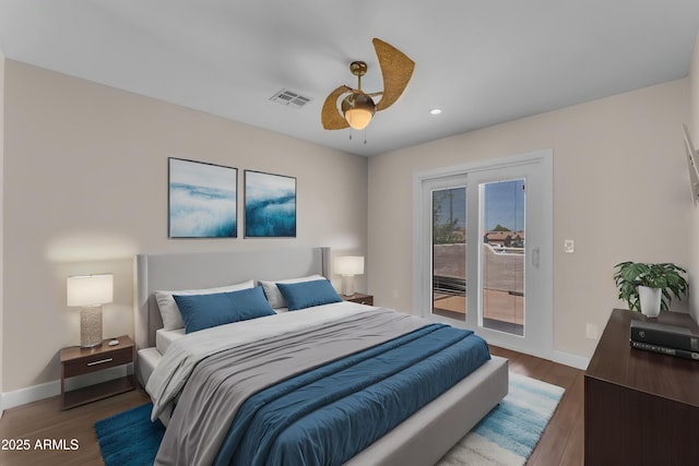 bedroom with visible vents, wood finished floors, baseboards, access to outside, and recessed lighting