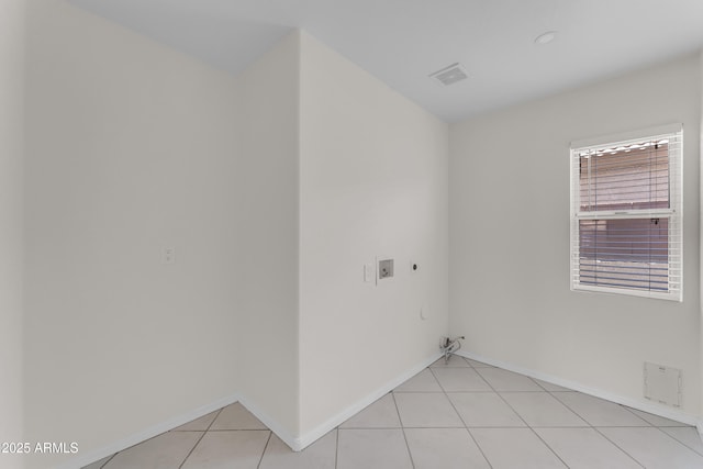 laundry area with washer hookup, laundry area, hookup for a gas dryer, electric dryer hookup, and light tile patterned floors