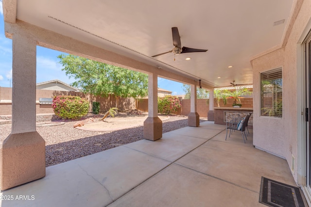 view of patio / terrace featuring a fenced backyard and a ceiling fan