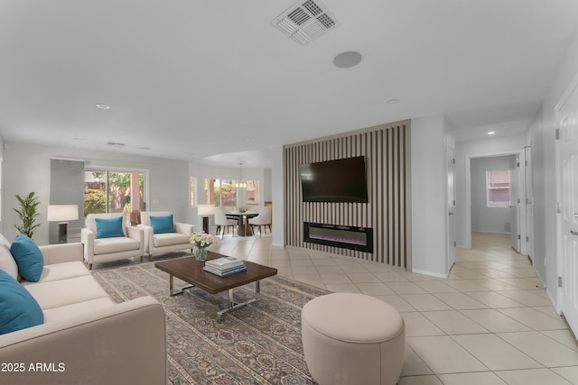 living area featuring visible vents, recessed lighting, and light tile patterned floors