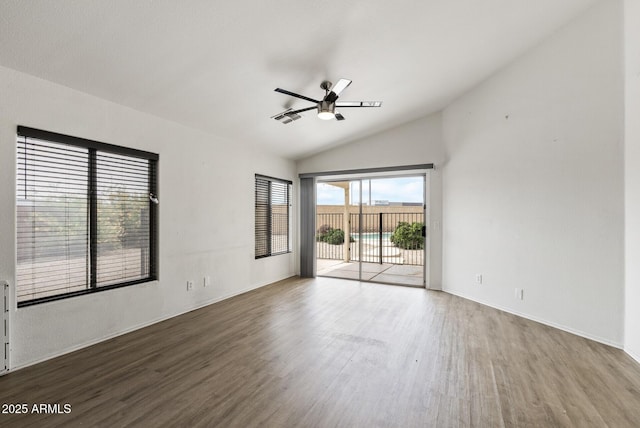 13438 N 130th Ln, El Mirage, AZ 85335 - empty room with lofted ceiling, wood finished floors, ceiling fan, and baseboards