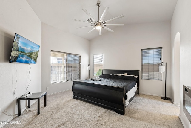 13438 N 130th Ln, El Mirage, AZ 85335 - bedroom with carpet floors, lofted ceiling, baseboards, a ceiling fan, and arched walkways