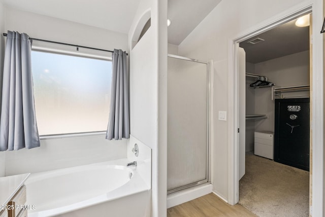 13438 N 130th Ln, El Mirage, AZ 85335 - bathroom with a shower stall, a garden tub, and a spacious closet