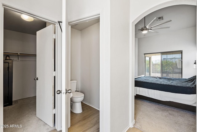 13438 N 130th Ln, El Mirage, AZ 85335 - ensuite bathroom with a ceiling fan, toilet, and baseboards