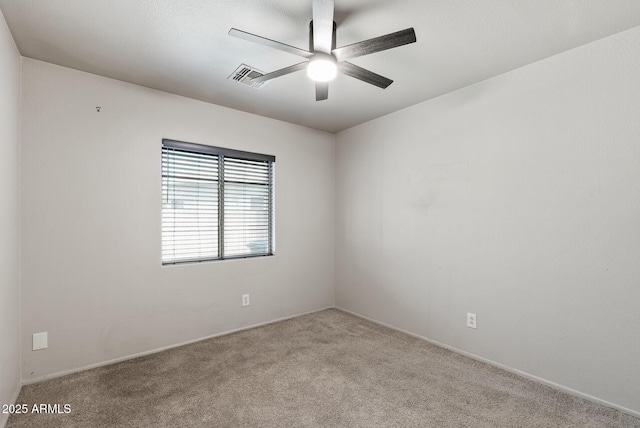 13438 N 130th Ln, El Mirage, AZ 85335 - spare room featuring carpet flooring, a ceiling fan, and baseboards