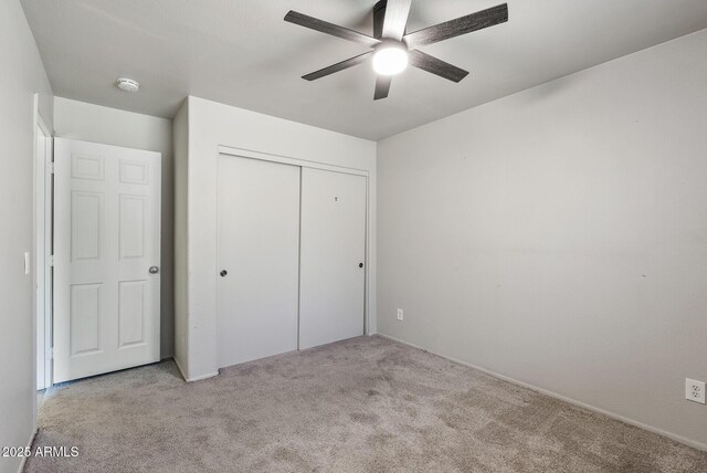 13438 N 130th Ln, El Mirage, AZ 85335 - unfurnished bedroom with carpet floors, a closet, and ceiling fan