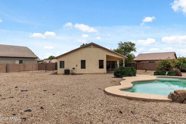 13438 N 130th Ln, El Mirage, AZ 85335 - back of property with stucco siding, a fenced backyard, central AC, and a patio area