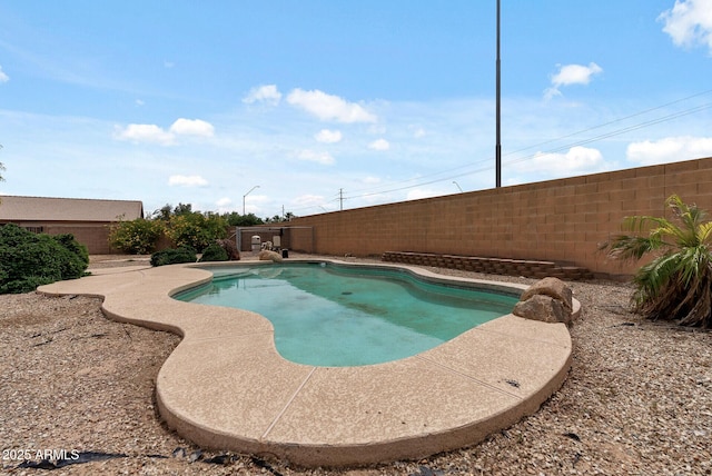 13438 N 130th Ln, El Mirage, AZ 85335 - view of pool featuring a fenced backyard and a patio