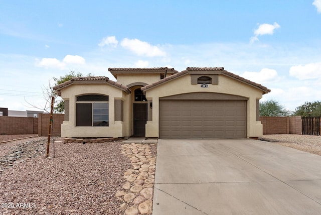 13438 N 130th Ln, El Mirage, AZ 85335 - mediterranean / spanish-style home featuring driveway, stucco siding, a garage, and a tiled roof