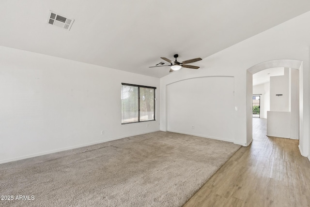 13438 N 130th Ln, El Mirage, AZ 85335 - unfurnished room with arched walkways, ceiling fan, and baseboards