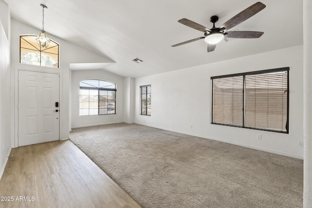 13438 N 130th Ln, El Mirage, AZ 85335 - foyer with vaulted ceiling, a chandelier, baseboards, ceiling fan, and carpet