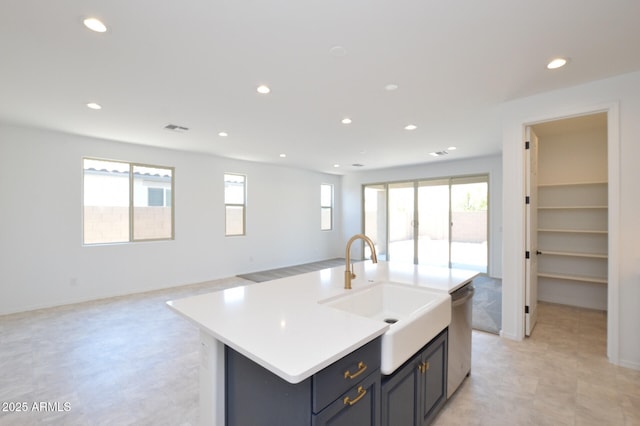 kitchen with visible vents, open floor plan, a sink, stainless steel dishwasher, and recessed lighting