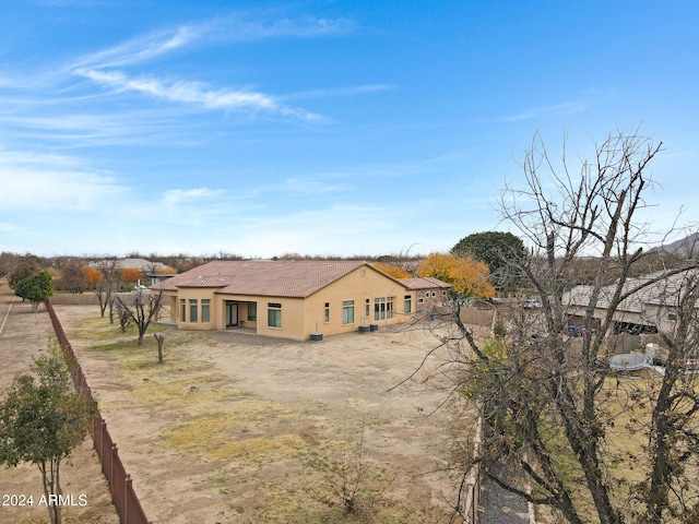 rear view of house with stucco siding