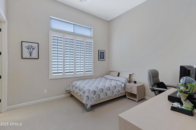 bedroom with carpet floors, visible vents, and baseboards