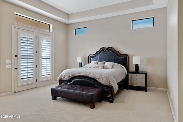 bedroom with access to outside, baseboards, and light colored carpet