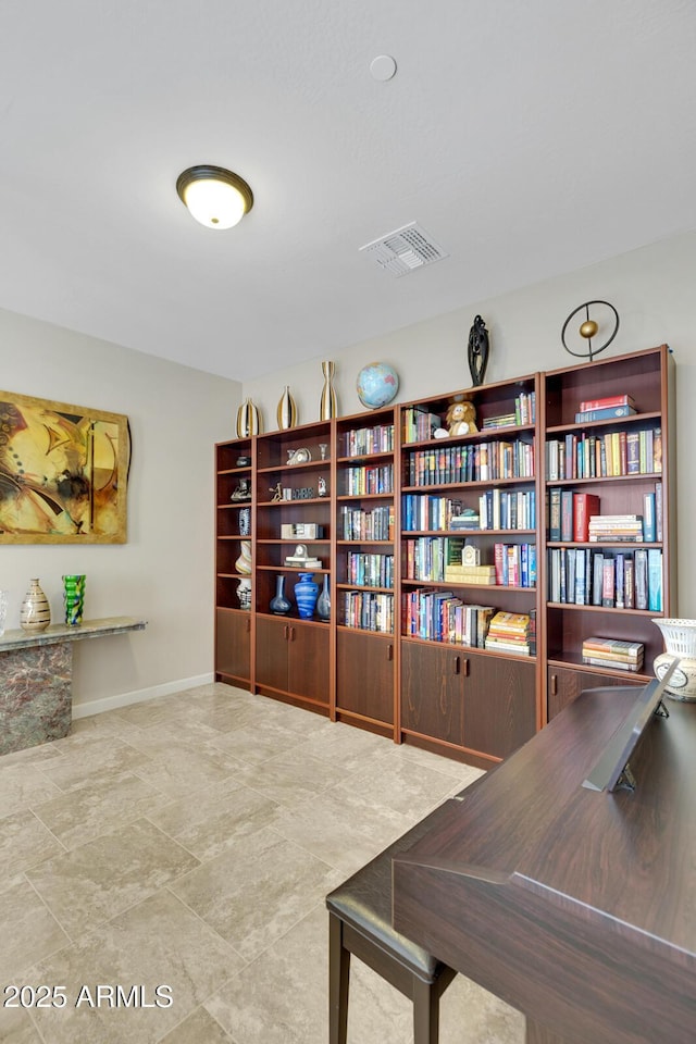 office area featuring visible vents and baseboards