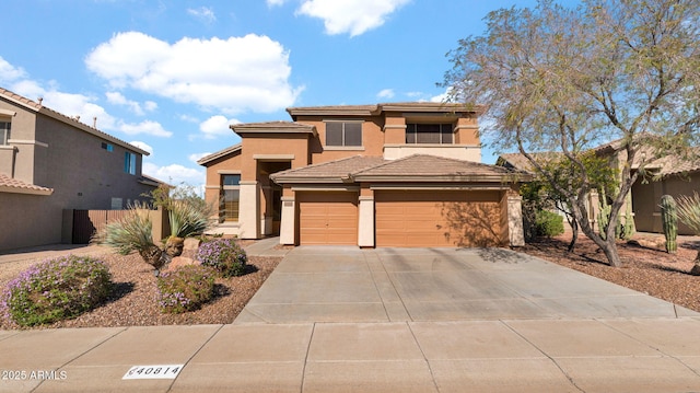 40814 N Majesty Ct, Anthem, AZ 85086 - view of front facade with stucco siding, driveway, a tile roof, and a garage