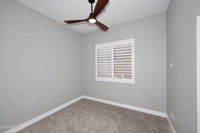 unfurnished room with visible vents, carpet flooring, a ceiling fan, and baseboards