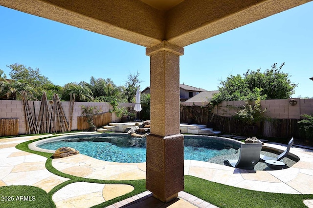 view of swimming pool featuring a fenced in pool and a fenced backyard
