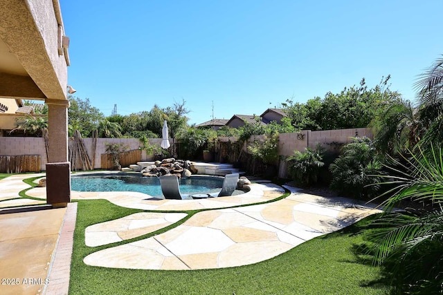 view of swimming pool with a patio area, a fenced backyard, and a fenced in pool
