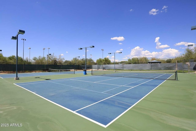 view of sport court featuring community basketball court and fence